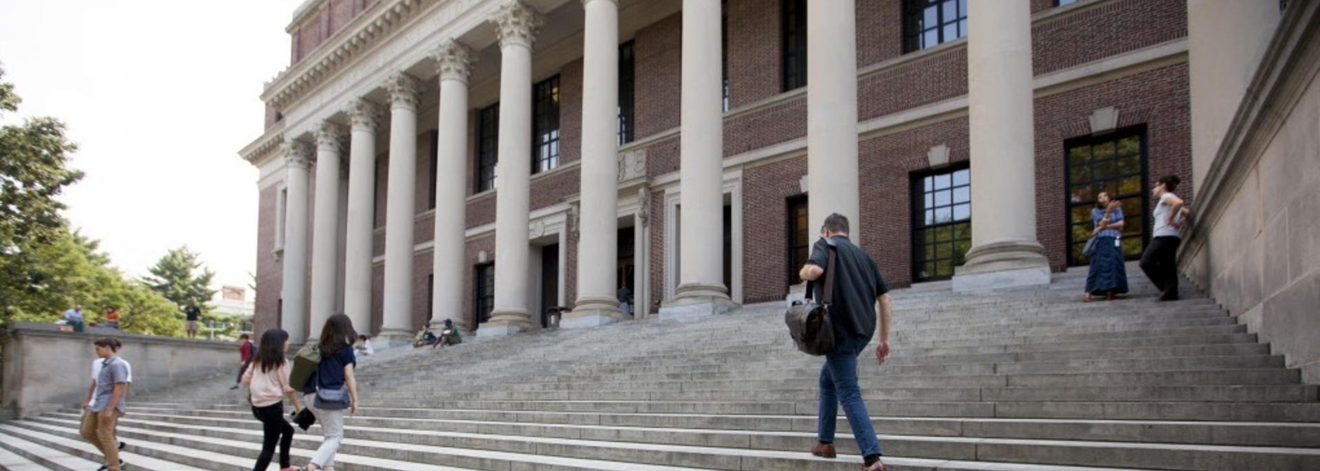 Students and visitors ascending and descending the steps in front of Widener Library.